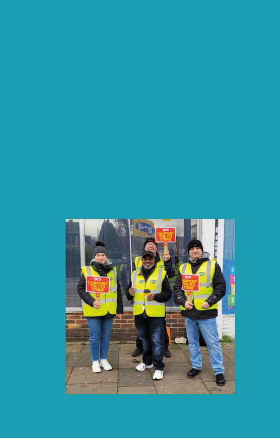 The image shows PCS members on a picket line.